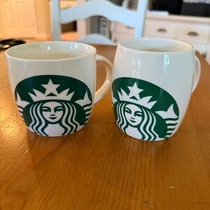 STARBUCKS two Coffee mugs with Starbucks Logo on it.